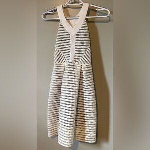 White children’s halter dress with navy lining